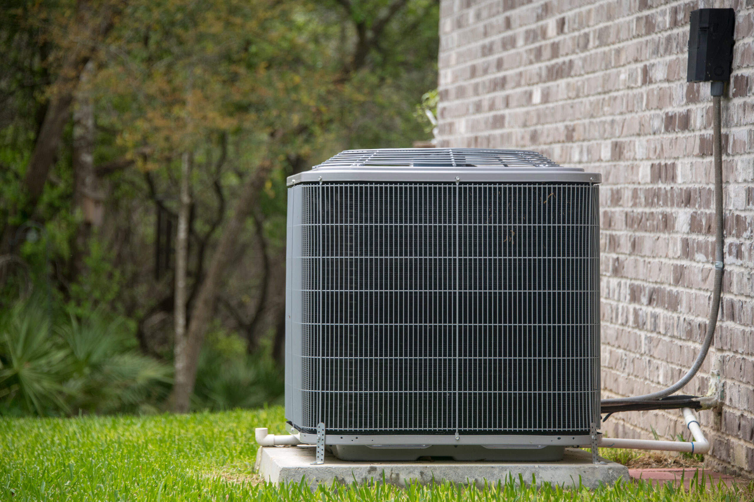 hvac unit outside a brick home