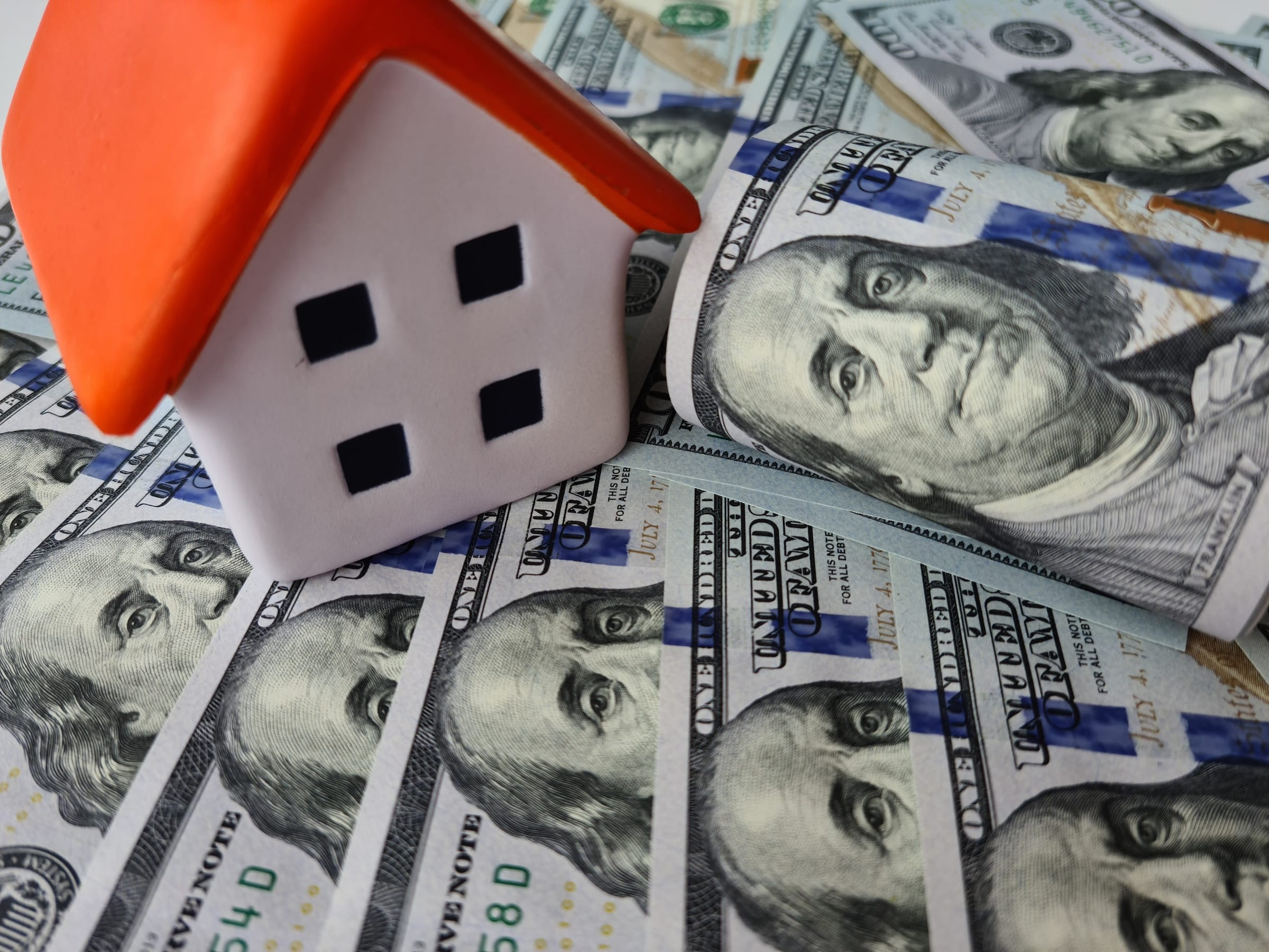 House concept with hundred dollar bills